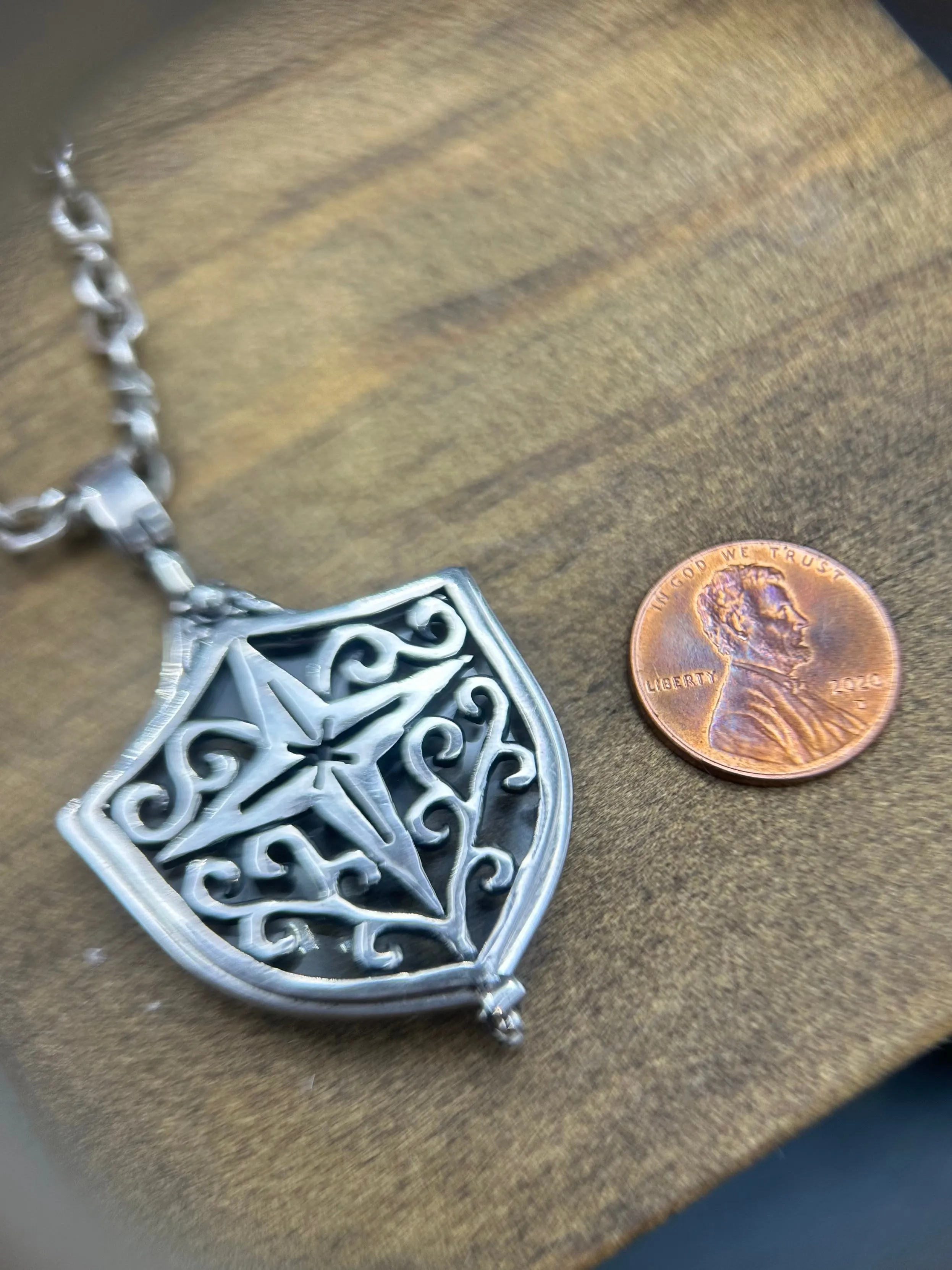 Magnified Glass Shield Pendant